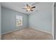 This bedroom features a window, carpet, and closet space at 905 Sewing Bee Pl., Little River, SC 29566