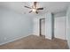 This bedroom features a ceiling fan, carpet and closet space at 905 Sewing Bee Pl., Little River, SC 29566