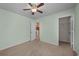 This bedroom features a ceiling fan, carpet and closet space at 905 Sewing Bee Pl., Little River, SC 29566