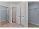 Walk-in closet with shelving and tile flooring for organized storage at 905 Sewing Bee Pl., Little River, SC 29566