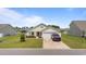 Attractive single-story home boasts a manicured lawn, attached garage, and welcoming curb appeal at 905 Sewing Bee Pl., Little River, SC 29566