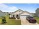 Charming single-story home with a well-manicured lawn and attached two-car garage at 905 Sewing Bee Pl., Little River, SC 29566