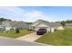Inviting single-level home features a tidy lawn, neutral siding, and an attached garage at 905 Sewing Bee Pl., Little River, SC 29566