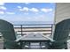 Oceanfront balcony with comfortable seating and stunning views of the beach at 920 N Waccamaw Dr. # 1302, Garden City Beach, SC 29576