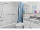 Cozy bathroom with shower, toilet, and marble vanity with sink, complemented by light-colored walls at 920 N Waccamaw Dr. # 1302, Garden City Beach, SC 29576