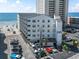 Exterior shot of Carolina Shores II, a multi-story condominium building with parking and beach access at 920 N Waccamaw Dr. # 1302, Garden City Beach, SC 29576