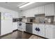Well-equipped kitchen with stainless steel appliances, granite counters, and white cabinetry for a clean look at 920 N Waccamaw Dr. # 1302, Garden City Beach, SC 29576