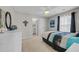 Comfortable primary bedroom with ensuite bathroom and a ceiling fan at 933 Wild Leaf Loop, Conway, SC 29526