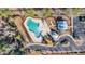 Aerial shot of a sparkling community pool, playground, and amenity center, perfect for Gathering fun at 933 Wild Leaf Loop, Conway, SC 29526