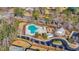 Overhead view of the community pool, clubhouse, playground, and surrounding landscape at 933 Wild Leaf Loop, Conway, SC 29526