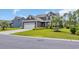 Well-maintained home with a two-car garage, tidy landscaping, and a lush green lawn at 933 Wild Leaf Loop, Conway, SC 29526