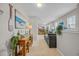 Inviting hallway with beachy decor that leads to a cozy living area with plush seating and natural light at 933 Wild Leaf Loop, Conway, SC 29526