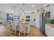 Modern kitchen boasts stainless steel appliances, granite countertops, and an island with seating for casual dining at 933 Wild Leaf Loop, Conway, SC 29526