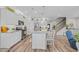 Bright kitchen features stainless steel appliances, granite countertops, and a central island with bar seating at 933 Wild Leaf Loop, Conway, SC 29526