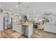 Open-concept kitchen with stainless steel appliances flowing into the living area, perfect for entertaining guests at 933 Wild Leaf Loop, Conway, SC 29526