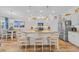 Well-lit kitchen with stainless steel appliances, granite countertops, and eat-in breakfast bar at 933 Wild Leaf Loop, Conway, SC 29526