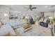 Open concept living area with plush sofas, modern decor, and seamless flow to the kitchen at 933 Wild Leaf Loop, Conway, SC 29526