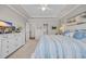 Relaxing bedroom retreat featuring a tray ceiling, plush bedding, and an ensuite bathroom for added privacy at 933 Wild Leaf Loop, Conway, SC 29526