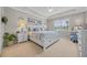 Bright bedroom with a tray ceiling, carpeted floors, and lake views from the window at 933 Wild Leaf Loop, Conway, SC 29526