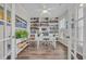 Bright office space with built-in bookshelves, hardwood floors, and natural light at 933 Wild Leaf Loop, Conway, SC 29526