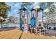Fun playground area with colorful equipment and soft ground cover, located near the community pool at 933 Wild Leaf Loop, Conway, SC 29526
