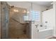 Bathroom featuring a glass shower and a soaking tub at 1009 Hopscotch Ln., Conway, SC 29526
