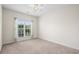 Bright bedroom with a ceiling fan, neutral walls and carpet at 1009 Hopscotch Ln., Conway, SC 29526