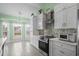 Well-lit kitchen with stainless steel appliances and decorative backsplash at 1009 Hopscotch Ln., Conway, SC 29526