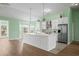 Modern kitchen with a large island, stainless steel appliances, and ample counter space at 1009 Hopscotch Ln., Conway, SC 29526