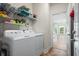 Laundry room with washer, dryer, and shelving at 1009 Hopscotch Ln., Conway, SC 29526