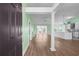Bright, open-concept living space with hardwood floors and modern architectural details at 1009 Hopscotch Ln., Conway, SC 29526