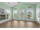 Bright sunroom with multiple windows and neutral walls at 1009 Hopscotch Ln., Conway, SC 29526
