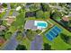 Aerial view of the community featuring the pool, tennis court, and picturesque landscaping at 103 Robin Ct., Murrells Inlet, SC 29576