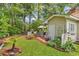 Charming backyard retreat with patio area and a storage shed surrounded by greenery at 103 Robin Ct., Murrells Inlet, SC 29576