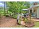 Inviting backyard with ample patio furniture and shade offered by surrounding trees at 103 Robin Ct., Murrells Inlet, SC 29576