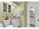 Compact bathroom featuring a vanity with an oval mirror and coordinated decor at 103 Robin Ct., Murrells Inlet, SC 29576