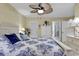 Cozy bedroom featuring a ceiling fan, white furniture, and bed with blue and white patterned linens at 103 Robin Ct., Murrells Inlet, SC 29576