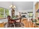 Elegant dining room with a chandelier, hardwood floors, and views into the living room at 103 Robin Ct., Murrells Inlet, SC 29576