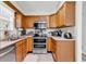 Efficient kitchen with stainless steel appliances, wood cabinetry, and updated fixtures at 103 Robin Ct., Murrells Inlet, SC 29576
