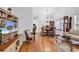Spacious living and dining area with hardwood floors, large windows, and lots of natural light at 103 Robin Ct., Murrells Inlet, SC 29576