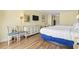 Comfortable suite with two beds, dining, and a full wall dresser with television at 1207 S Ocean Blvd. # 51001, Myrtle Beach, SC 29577