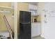 Compact kitchenette with modern refrigerator, microwave, and essential appliances at 1207 S Ocean Blvd. # 51001, Myrtle Beach, SC 29577