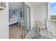 View from the balcony showing the bedroom with a bed and seating at 1207 S Ocean Blvd. # 51312, Myrtle Beach, SC 29577