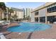 Inviting outdoor pool area with brick surround, sun loungers, and convenient access to nearby parking and building amenities at 1207 S Ocean Blvd. # 51312, Myrtle Beach, SC 29577