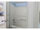 Clean shower area in condo bathroom with shower curtain and tub at 1207 S Ocean Blvd. # 51312, Myrtle Beach, SC 29577