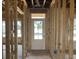 Framed entryway of a new home, featuring a door and natural light streaming in at 123 Westfield Circle, Conway, SC 29526