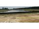 Scenic view of a tranquil pond surrounded by open land and lush greenery, creating a serene natural setting at 123 Westfield Circle, Conway, SC 29526
