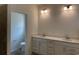 Bright bathroom featuring double sink vanity with modern fixtures and lighting at 126 Westfield Circle, Conway, SC 29526