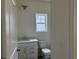 Bathroom with white vanity, modern fixtures, and a large window for natural light at 126 Westfield Circle, Conway, SC 29526