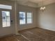Bright entryway featuring tray ceiling, chandelier, and natural light streaming through the windows at 126 Westfield Circle, Conway, SC 29526